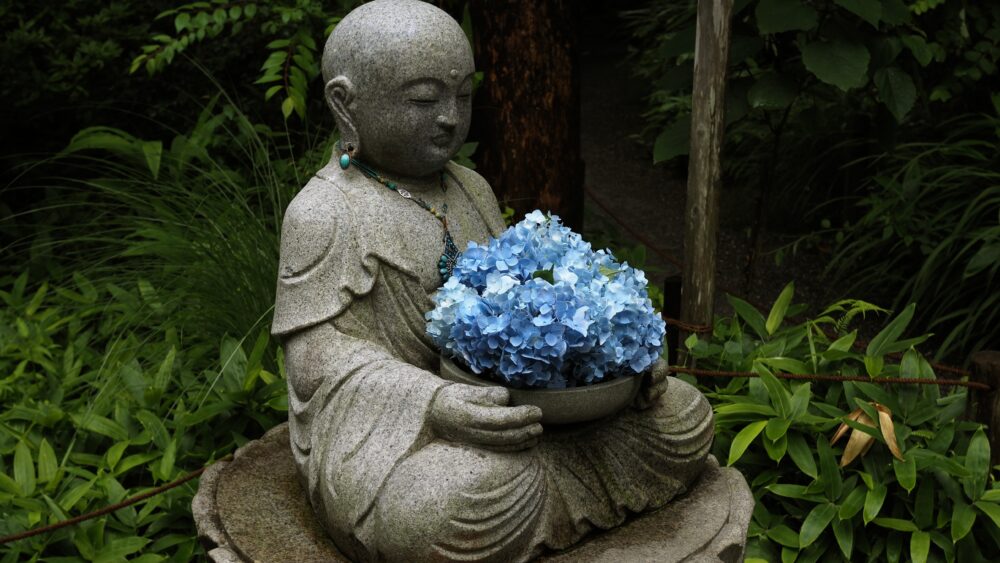 Ojizo-san has a little bouquet of hydrangea